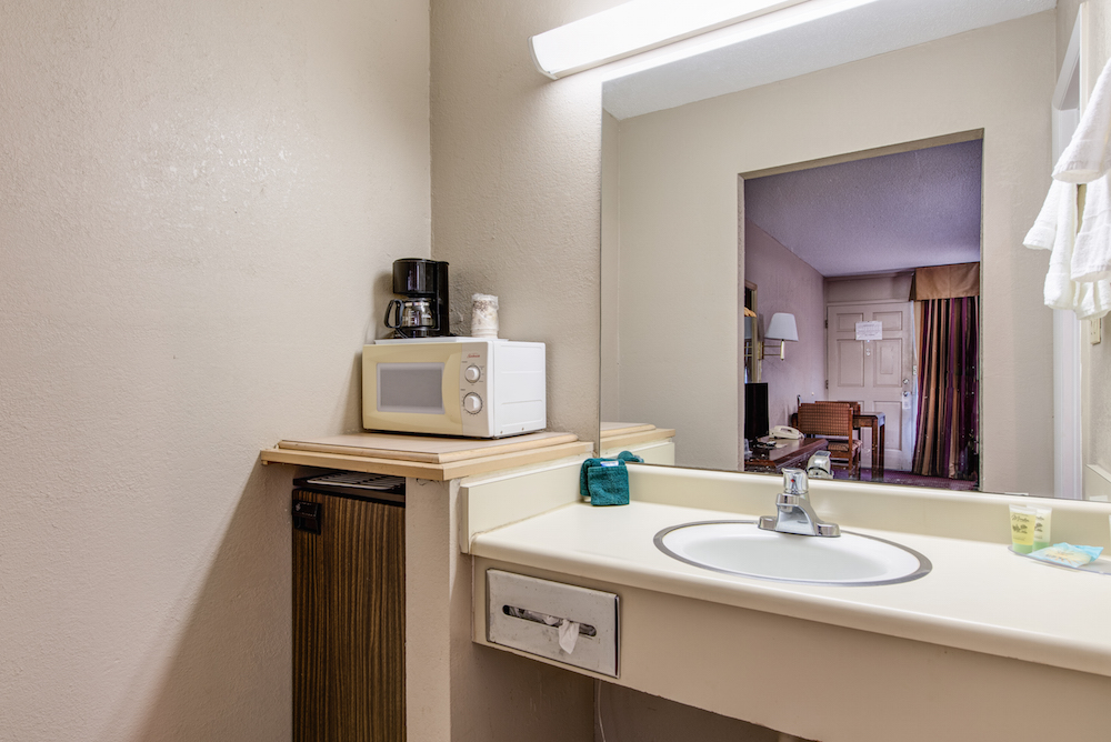 sink and mini fridge in green valley motel